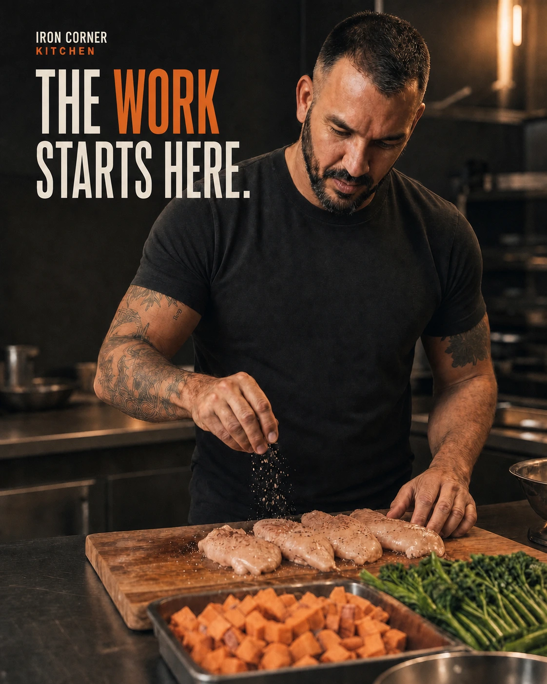 Frankie seasoning chicken in the Iron Corner kitchen — the work starts here