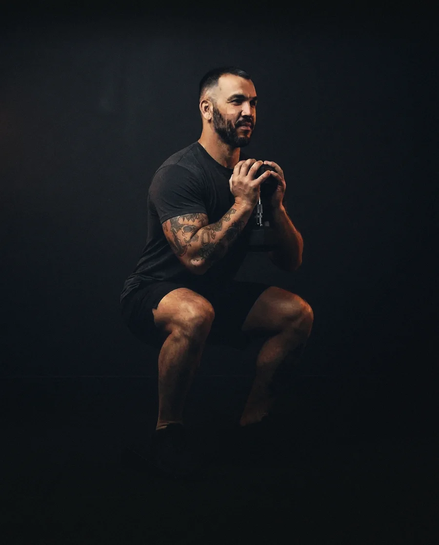 Frankie demonstrates Heel-elevated dumbbell goblet squat